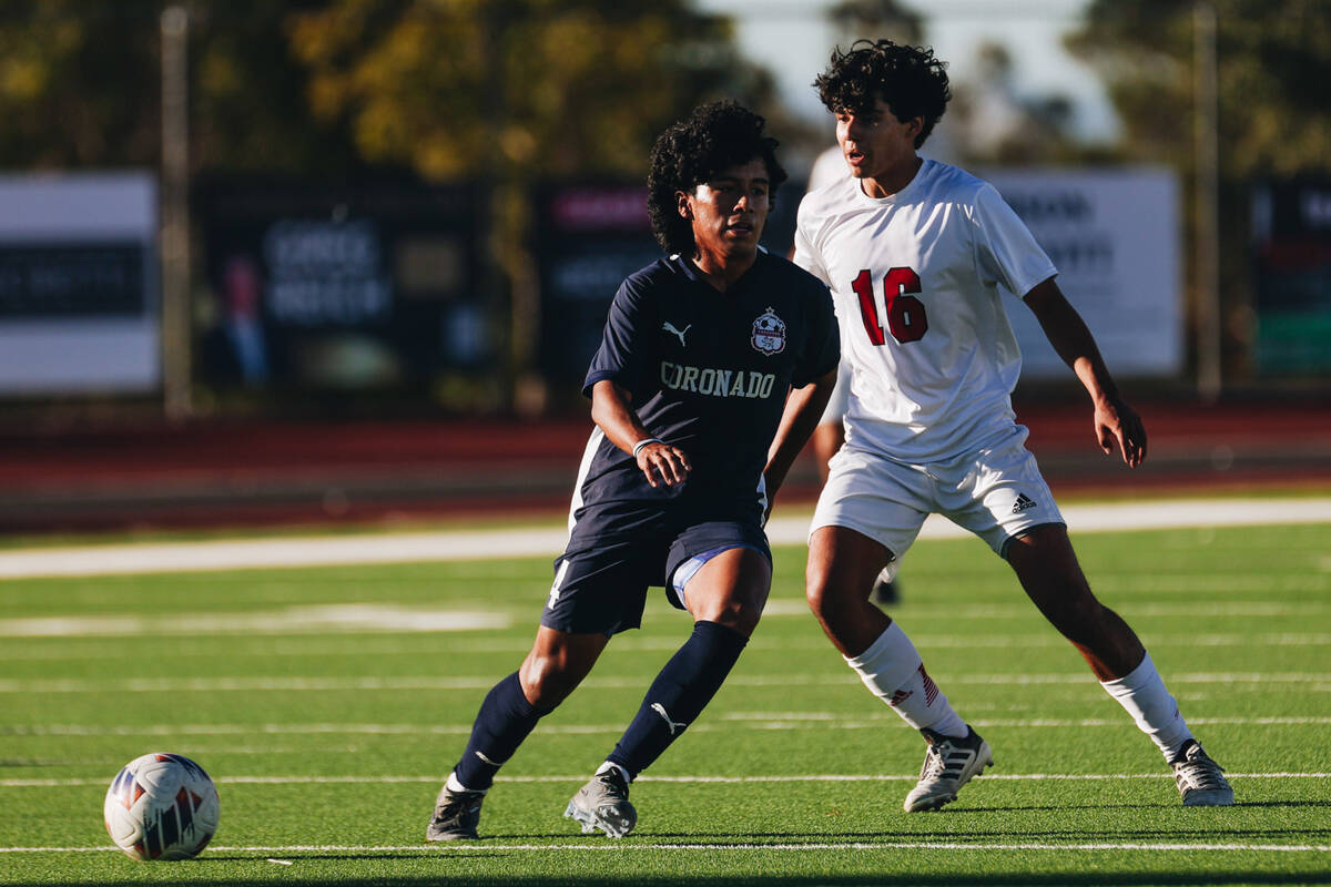 Coronado’s Mark Abijmil (4) and Arbor View midfielder Anthony Medina (16) run after the ...