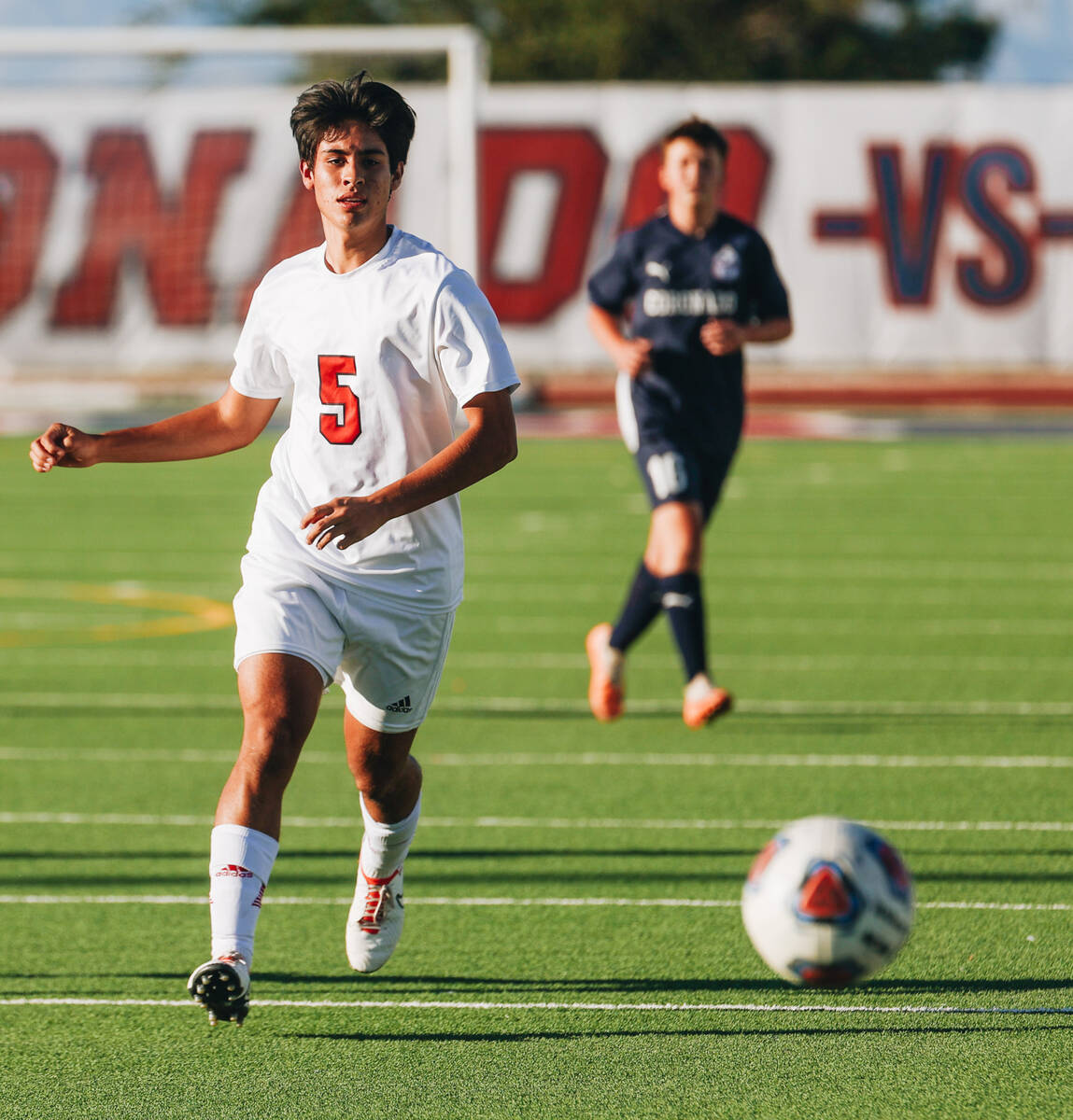 Arbor View midfielder Gabriel Estrada (5) runs after the ball at Coronado High School on Wednes ...