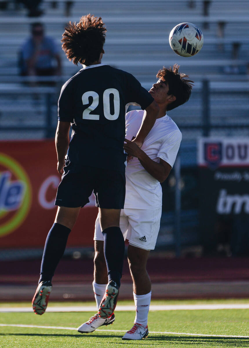 Coronado’s Cy Adams (20) jump into the air for the ball during a game against Arbor View ...