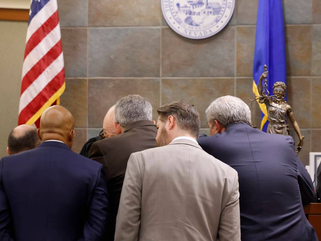 Attorneys for plaintiffs and for Real Water listen to District Judge Timothy Williams during a ...