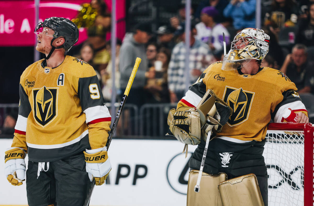 Golden Knights goaltender Logan Thompson (36) and Golden Knights center Jack Eichel (9) watcha ...