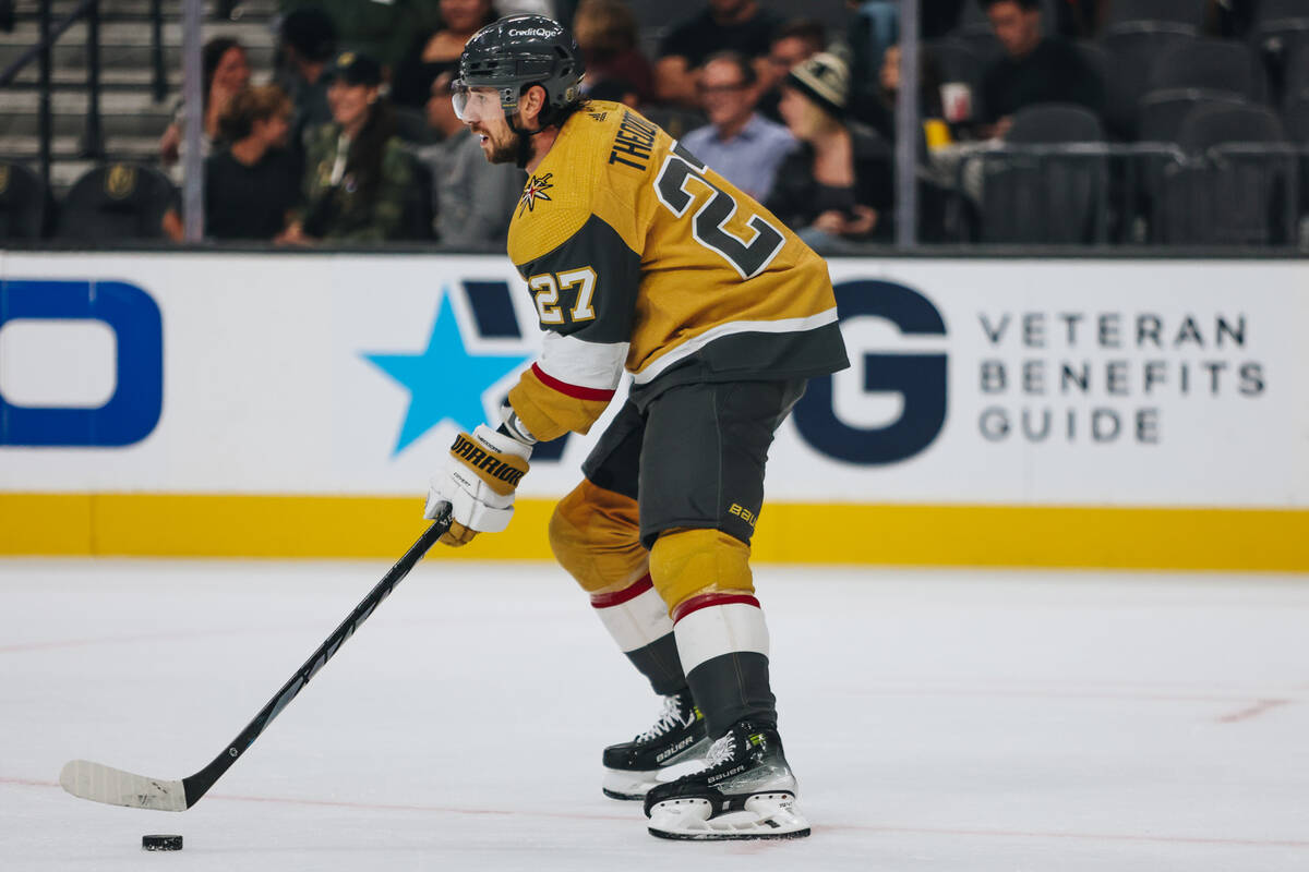 Golden Knights defenseman Shea Theodore (27) skates the puck across the ice during a game again ...