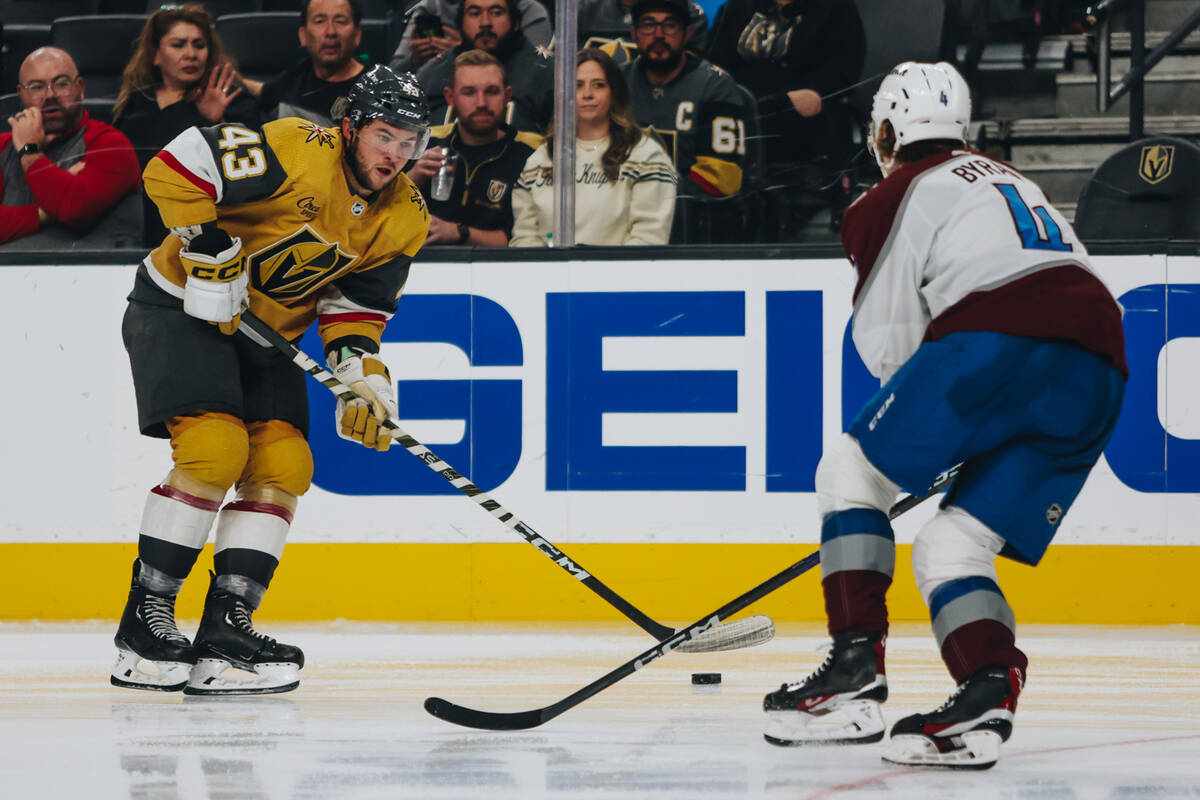 Golden Knights left wing Paul Cotter (43) and Colorado Avalanche defenseman Bowen Byram (4) rac ...