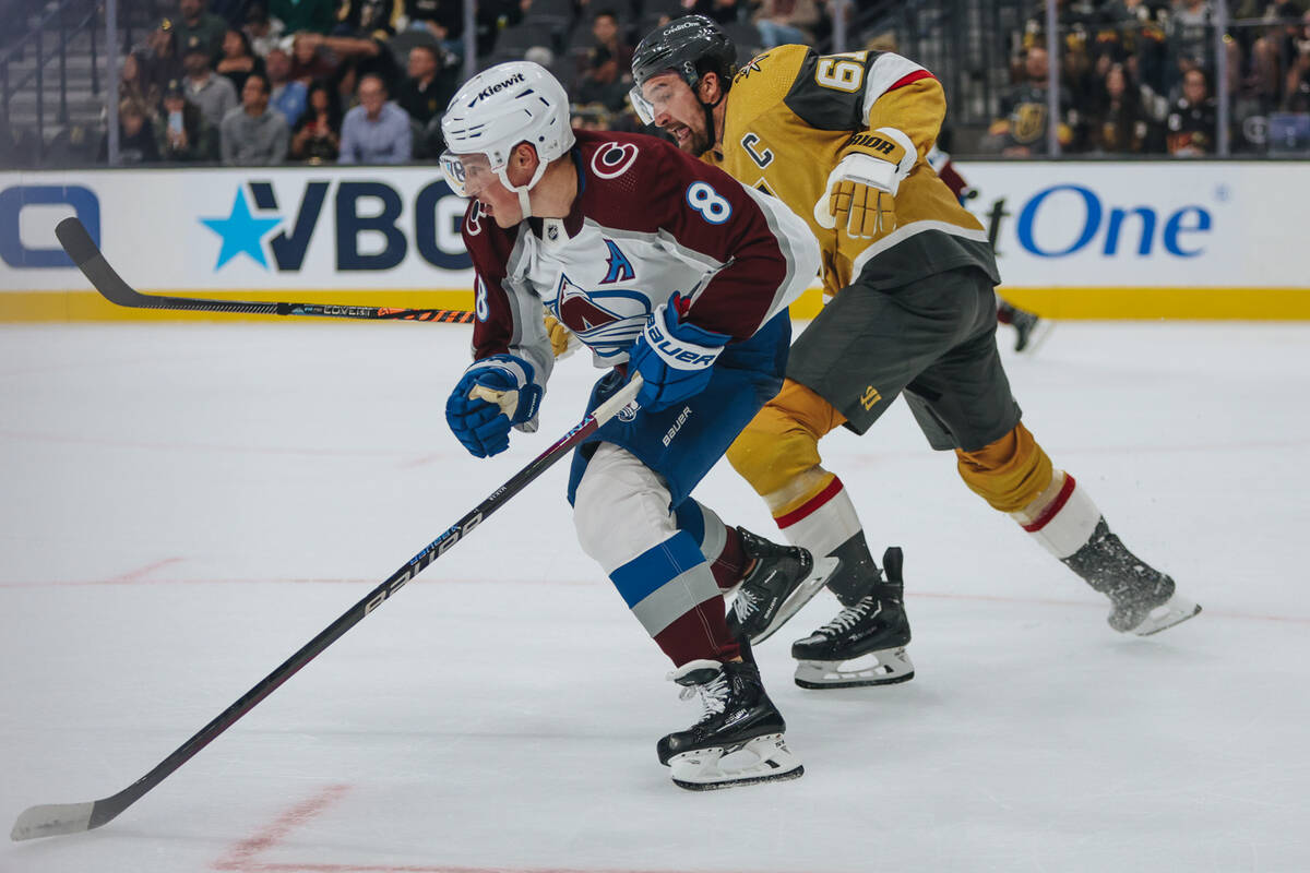 Golden Knights captain Mark Stone (61) chases after Colorado Avalanche defenseman Cale Makar (8 ...