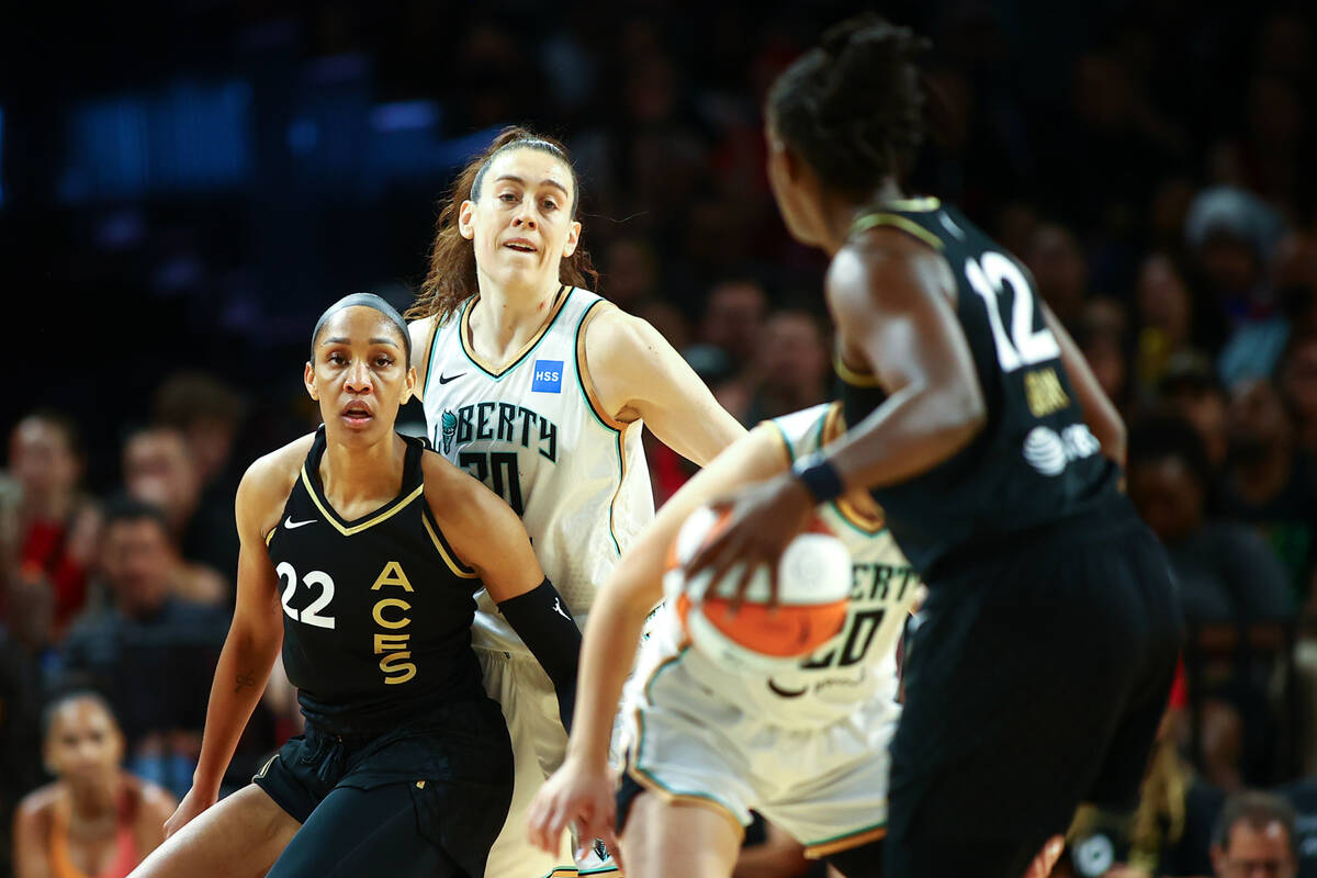 Las Vegas Aces forward A'ja Wilson (22) guards New York Liberty forward Breanna Stewart (30) wh ...