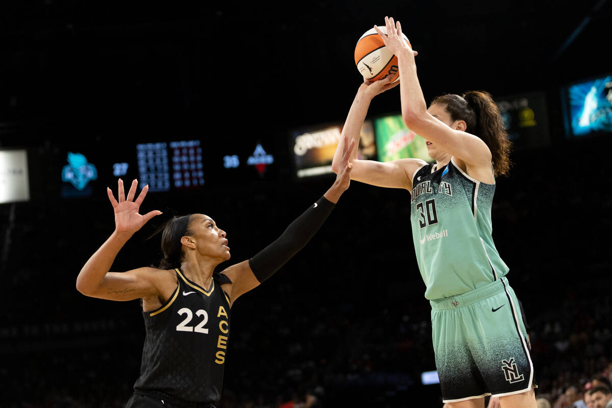 Las Vegas Aces forward A'ja Wilson (22) defends while New York Liberty forward Breanna Stewart ...