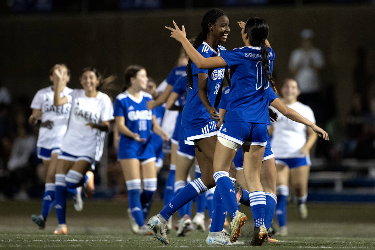 Bishop Gorman midfielders Amiya Warner (12) and Robyn Dizon (11) celebrate their win against Li ...