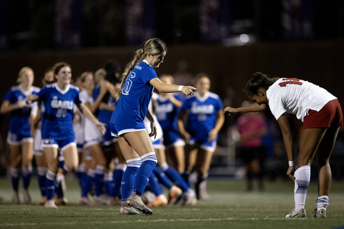 Bishop Gorman defender Tatum Manley (26) congratulates Liberty's Ayva Jordan (14) on a good gam ...