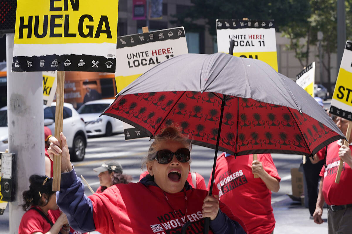 Striking hotel workers rally outside the InterContinental Los Angeles Downtown Hotel on Tuesday ...
