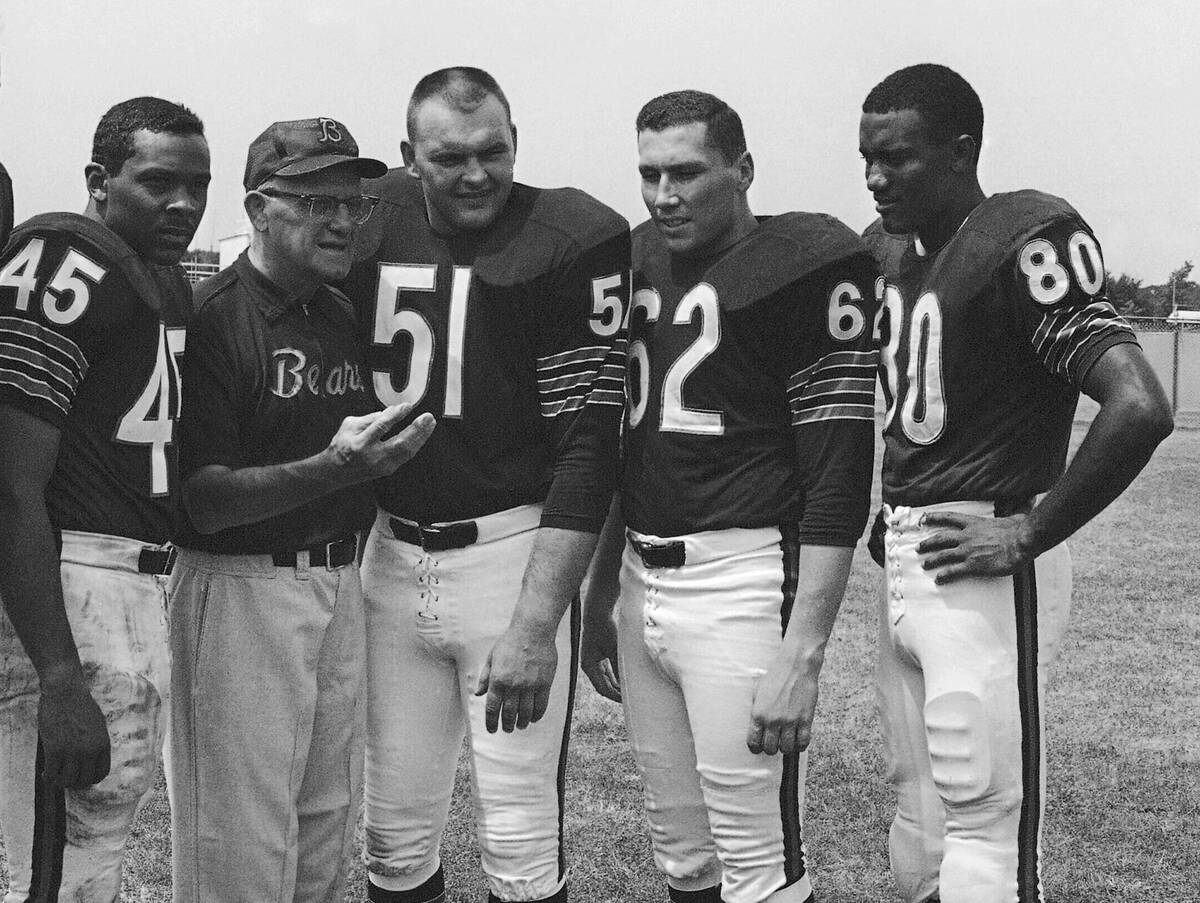 Chicago Bears coach George Halas discusses the upcoming season with four of his second-year men ...