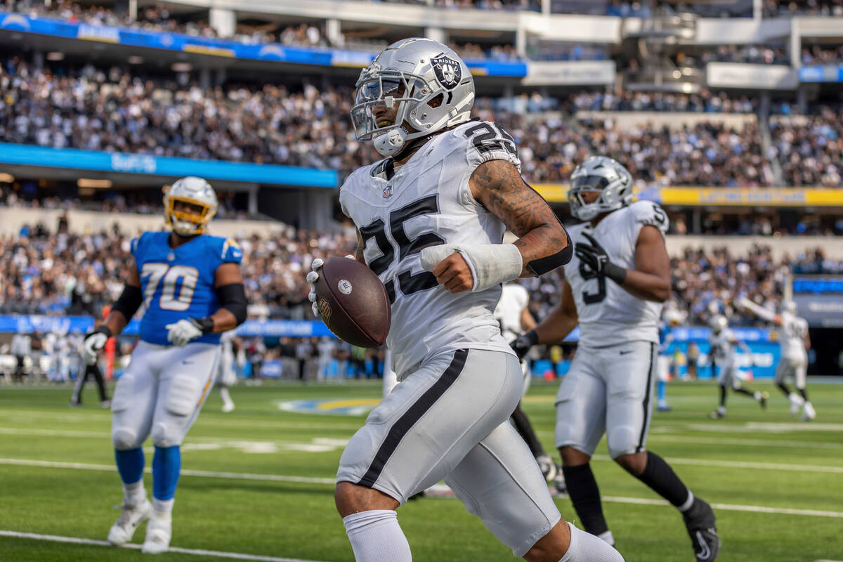 Las Vegas Raiders safety Tre'von Moehrig (25) intercepts a pass against the Los Angeles Charger ...