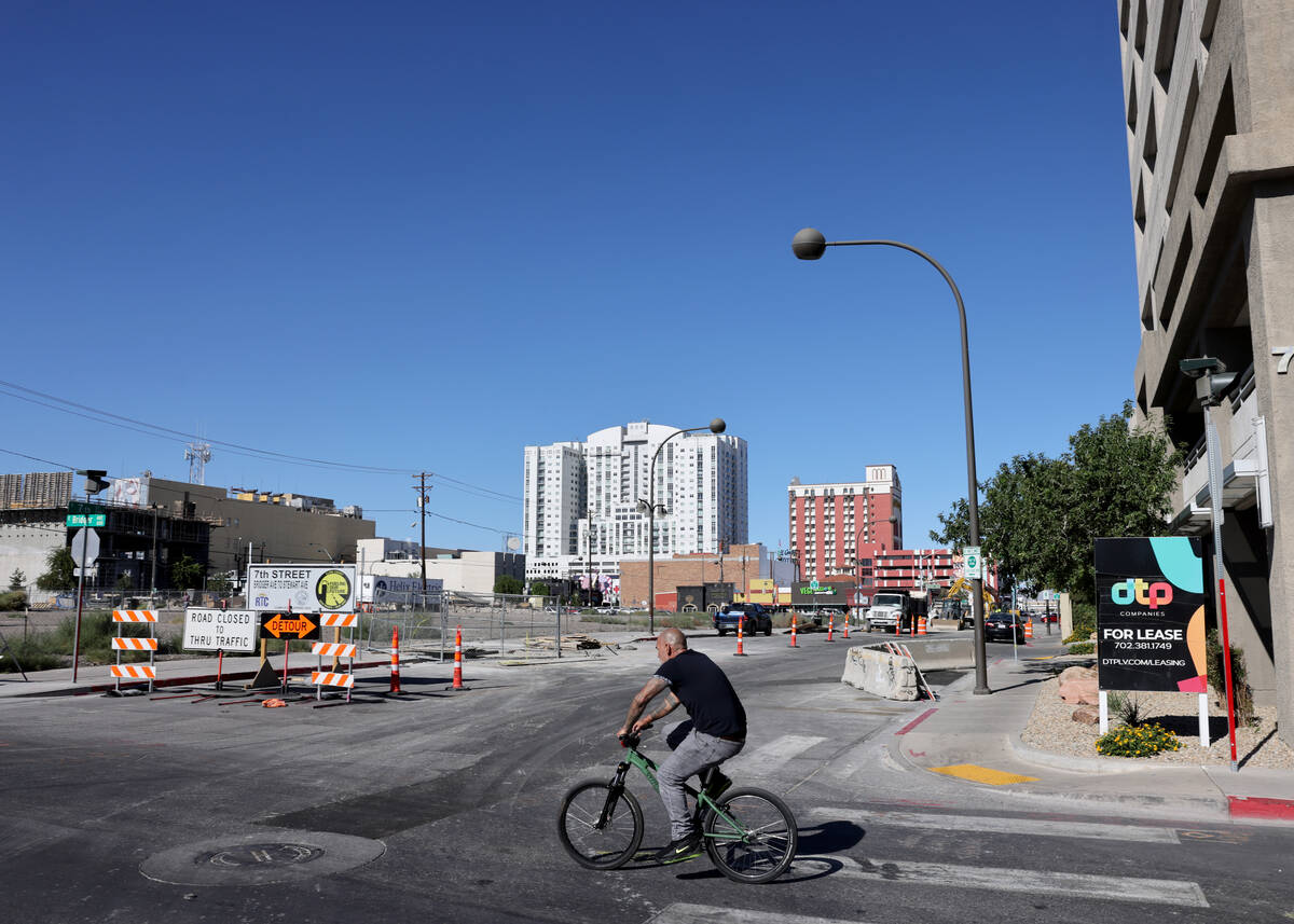 A bicyclist crosses Bridger Avenue at Seventh Street in downtown Las Vegas as construction cont ...
