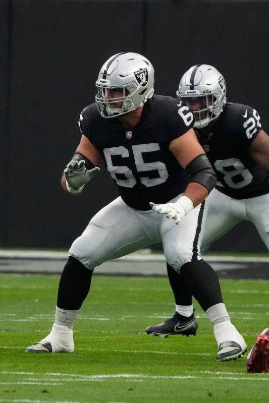 Las Vegas Raiders center Hroniss Grasu (65) blocks against the New England Patriots during the ...