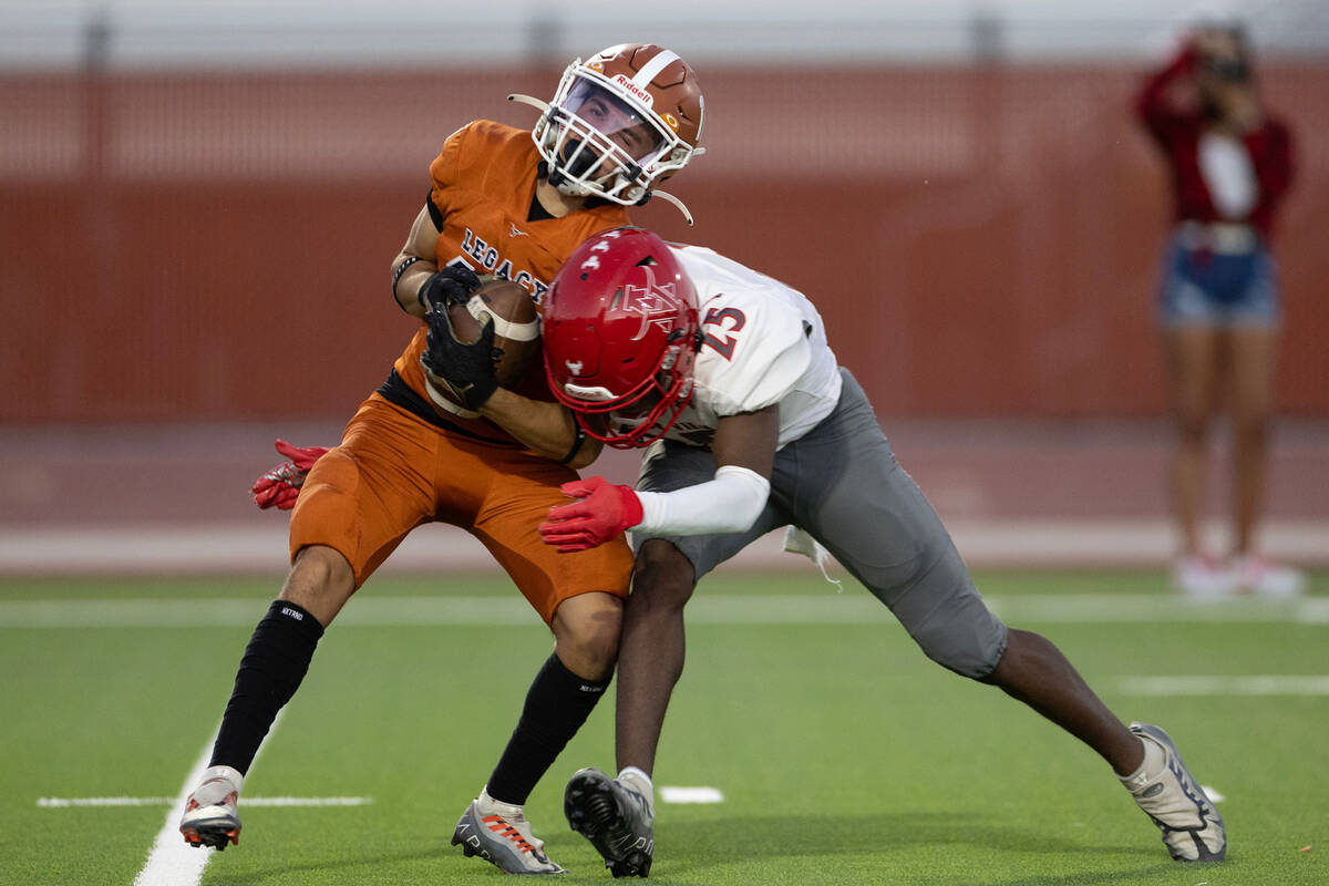 Legacy running back Fabian Carmona (17) pivots before evading a tackle by Arbor View defensive ...