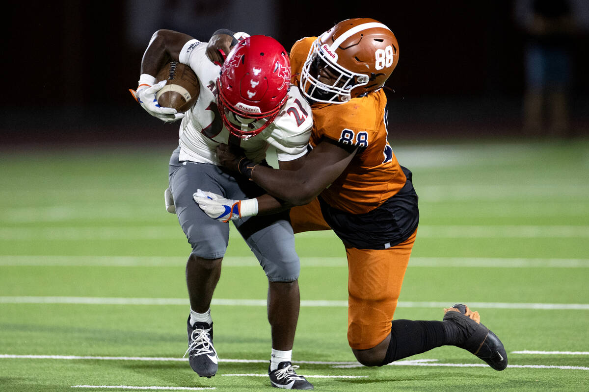 Legacy’s Semaj Williams (88) tackles Arbor View running back Sean Moore (21) during the ...