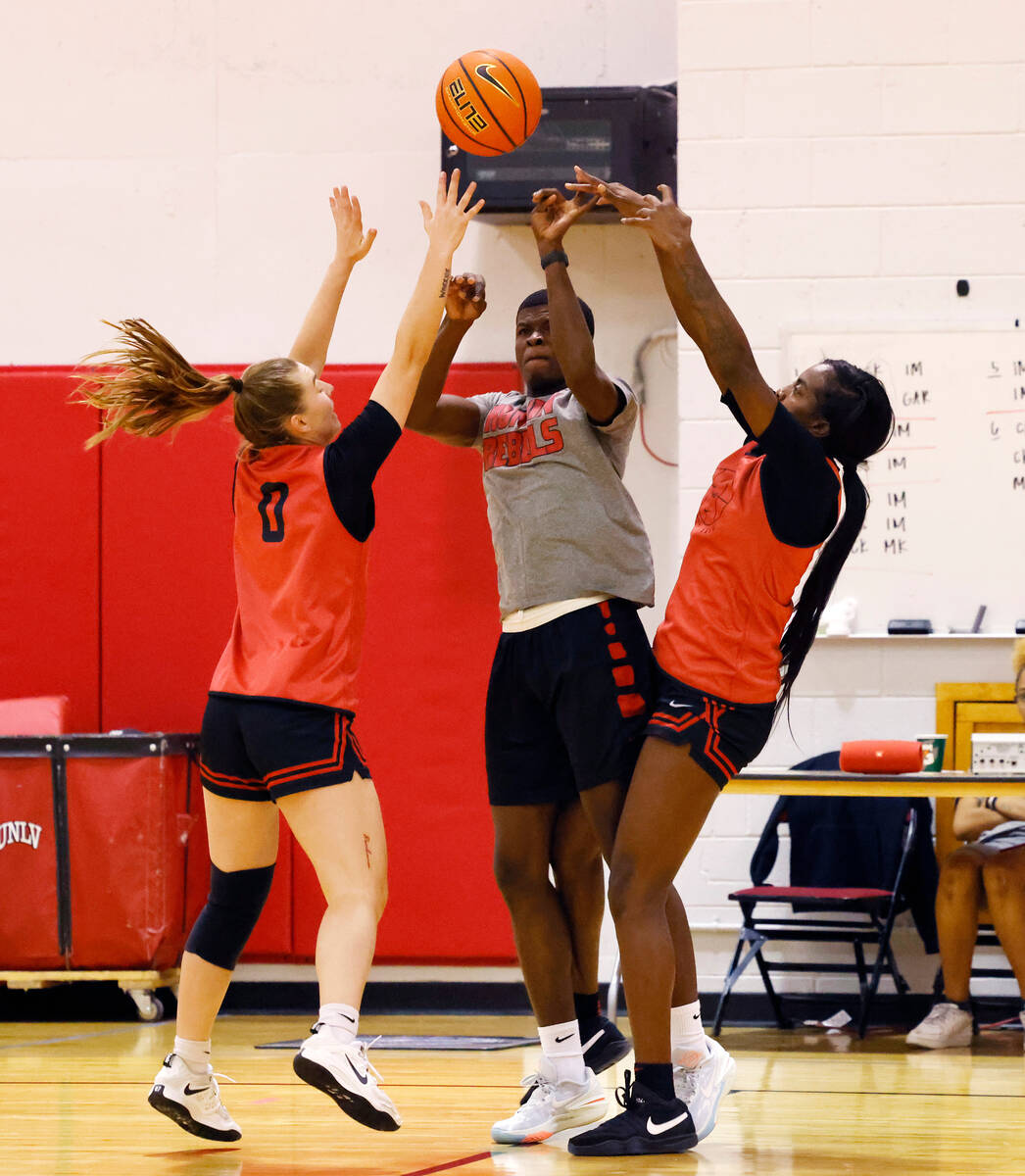 UNLV Lady Rebels Ashley Scoggin (0) and Desi-Rae Young (23) defend during team practice, on Fri ...