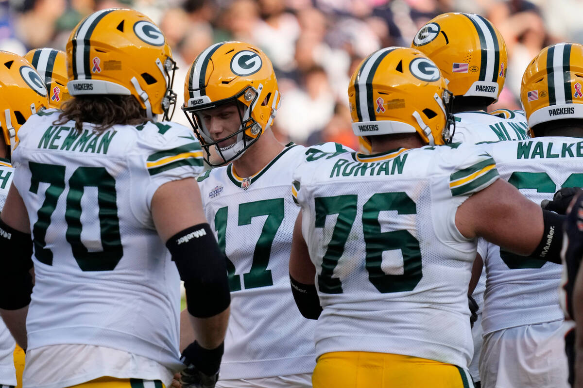 Green Bay Packers place kicker Anders Carlson (17) celebrates with teammates after scoring an e ...