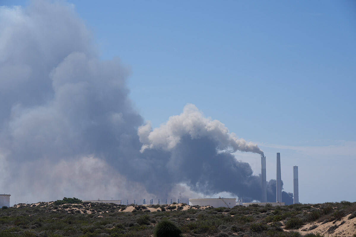 Smoke rises from an area near a power plant outside Ashkelon, Israel, on Saturday, Oct. 7, 2023 ...