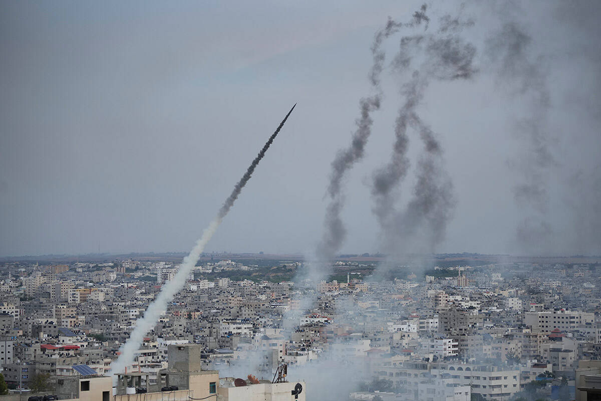 Rockets are launched by Palestinian militants from the Gaza Strip towards Israel, in Gaza, Satu ...