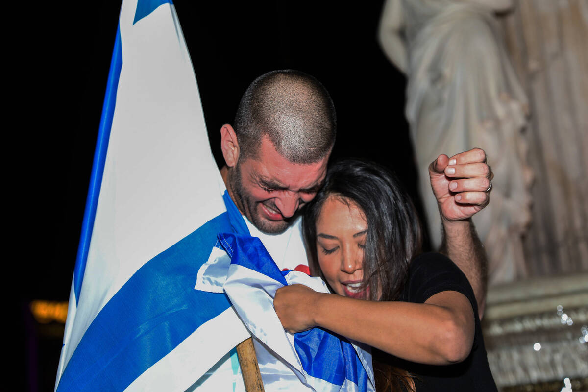 Pro Israel supporters mourn for their friends and family in Israel during a gathering in front ...