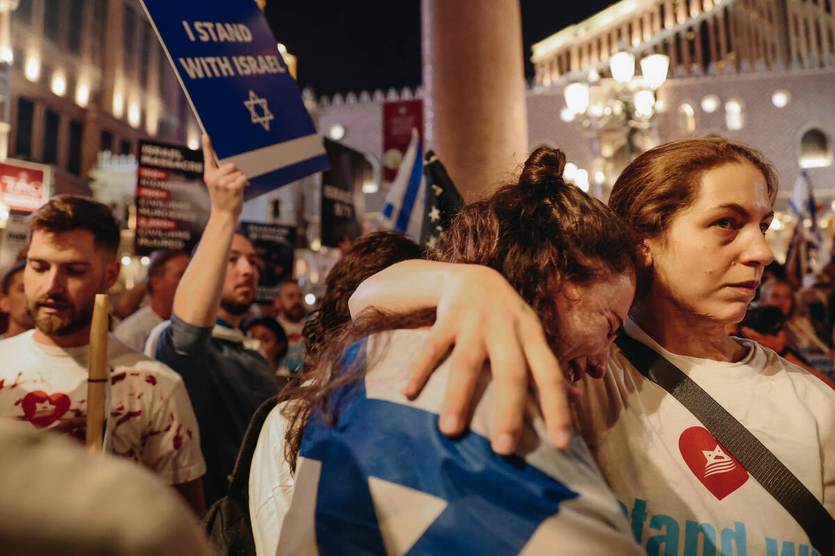 A woman cries during a pro-Israel rally outside the Venetian on Sunday, Oct. 8, 2023, in Las Ve ...