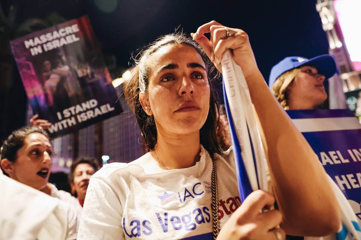 A woman cries during a pro-Israel rally outside the Venetian on Sunday, Oct. 8, 2023, in Las Ve ...