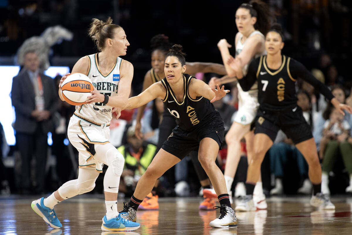 Las Vegas Aces guard Kelsey Plum (10) defends against New York Liberty guard Courtney Vanderslo ...