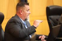 Detective Aaron Snyder, with the North Las Vegas Police Department, goes over details of the fa ...