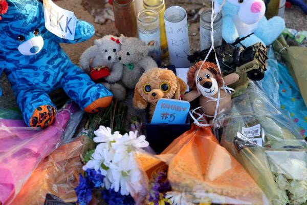 A memorial for Kamari Jordan Wolfe is seen as students arrive for school at Somerset Academy’ ...
