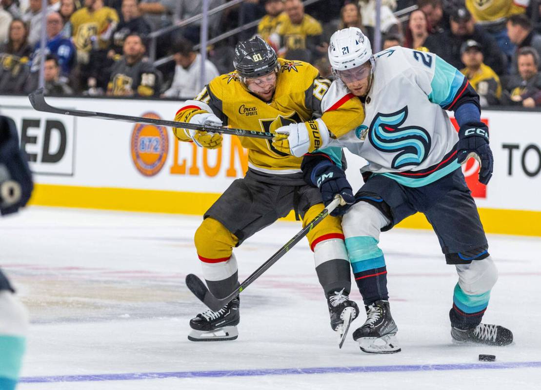 Golden Knights right wing Jonathan Marchessault (81) battles for the puck with Seattle Kraken c ...