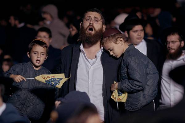 Chabad-Lubavitch Orthodox Jews sing during a vigil held in solidarity and prayer for Israel on ...