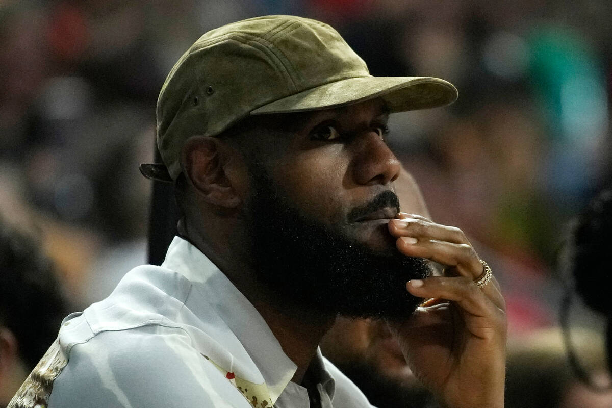 LeBron James watches during the first half in Game 1 of a WNBA basketball final playoff series ...