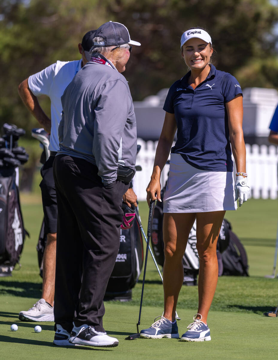 Lexi Thompson talks during putting practice as she will be the seventh woman to play in a PGA T ...