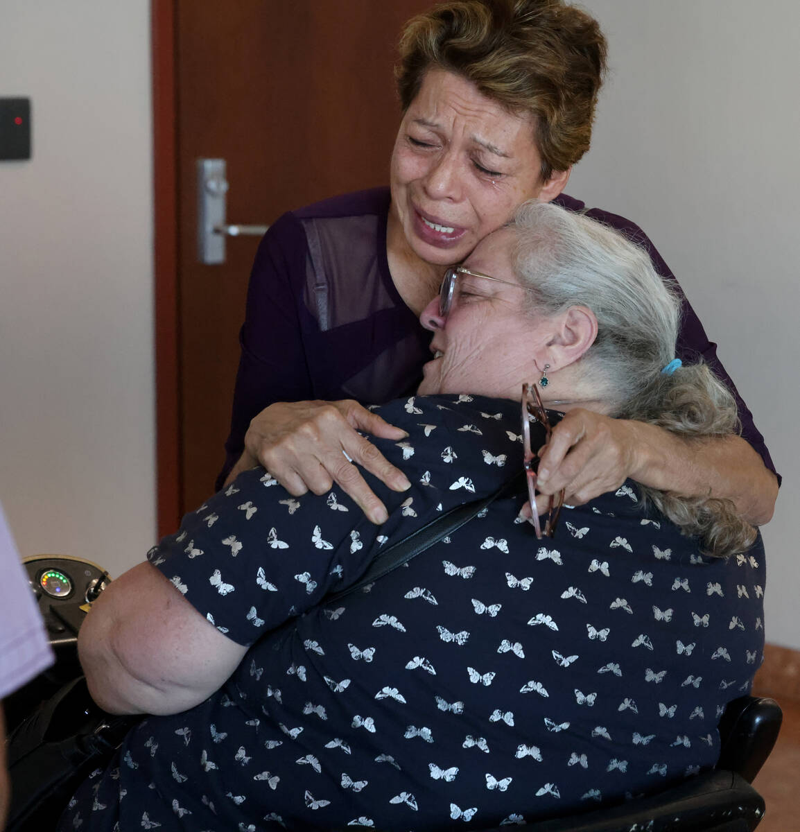 Catarina Chicas, mother of Jennifer Chicas, top, hugs Tonette Mendoza, mother of Melissa Mendoz ...