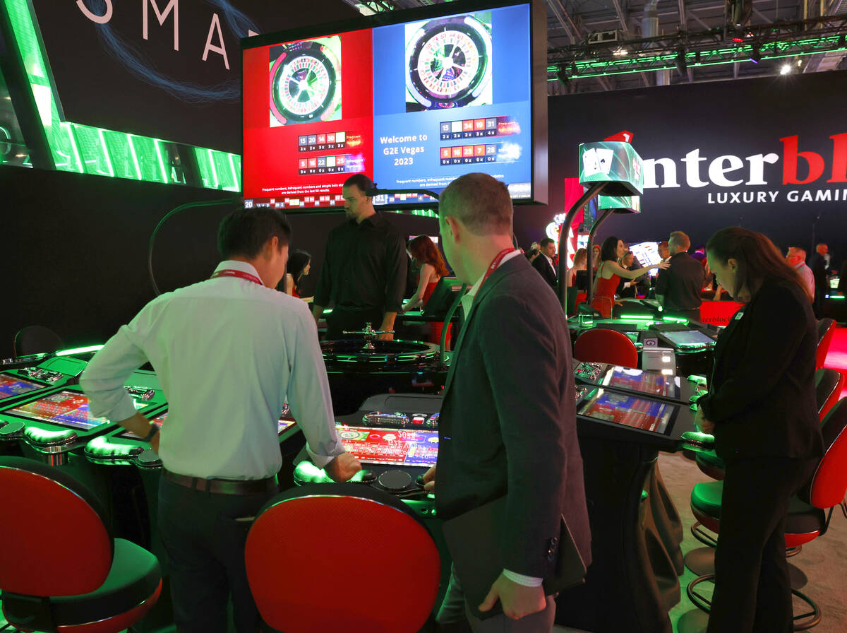 Conventioneers try out Interblock Gaming's Smart Pit Roulette at G2E Las Vegas at Sands Expo, o ...