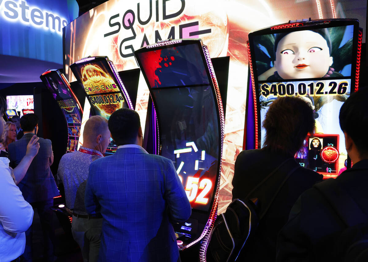 Conventioneers line up to play Squid Game at Light and Wonder booth at G2E Las Vegas at Sands E ...
