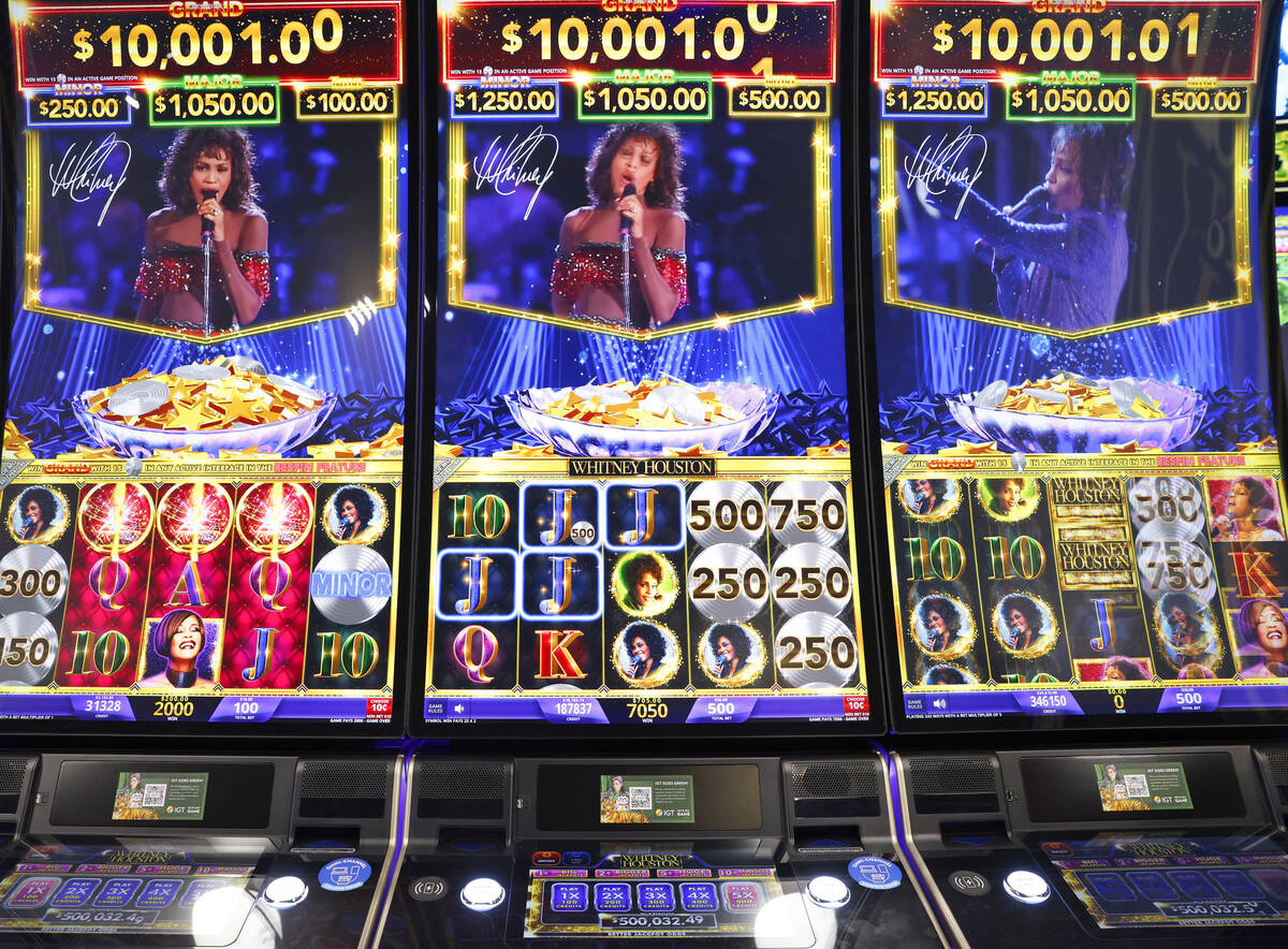 IGT's Skyrise cabinets with Whitney Houston video slots are displayed at IGT booth at G2E Las ...