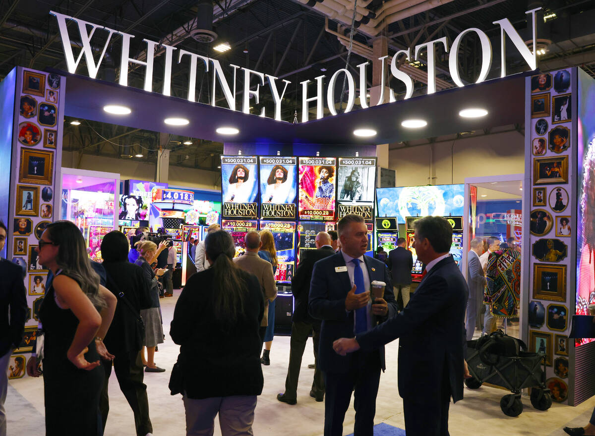 IGT's Skyrise cabinets with Whitney Houston video slots are displayed at IGT booth at G2E Las V ...