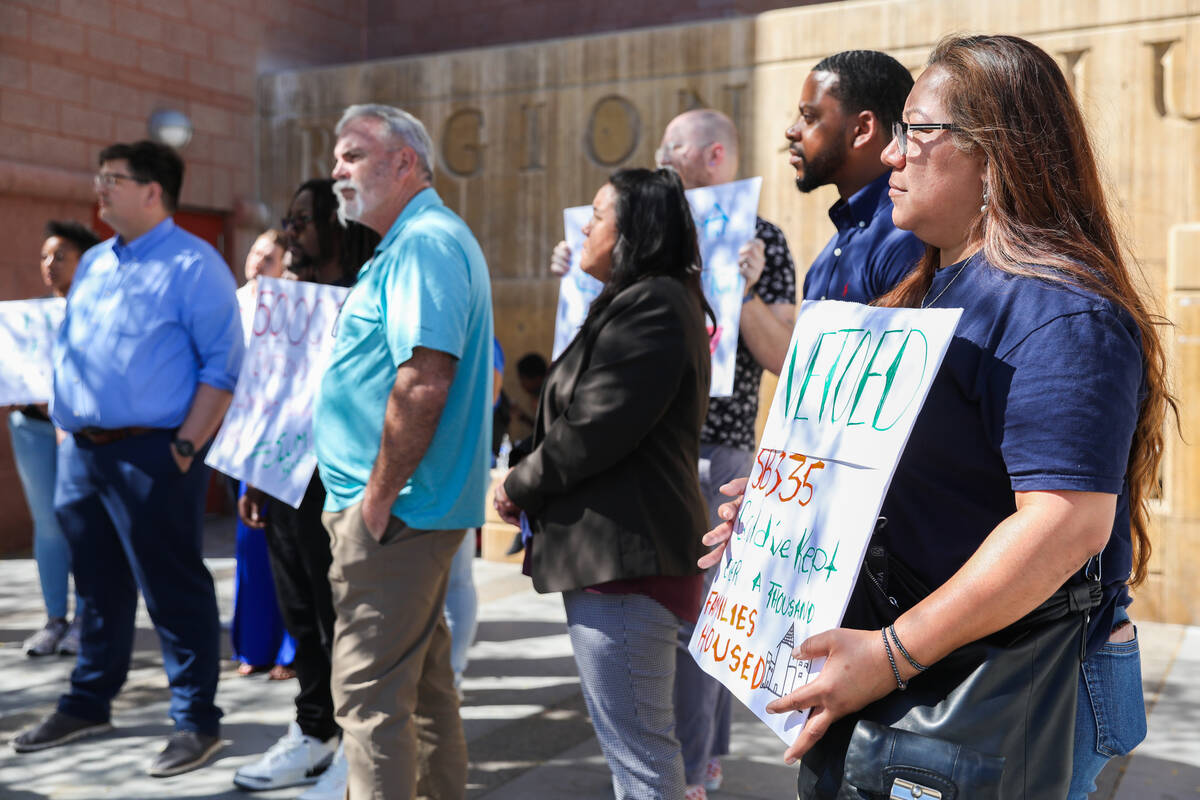 Activists and community members gather together in support of tenant rights during a press conf ...