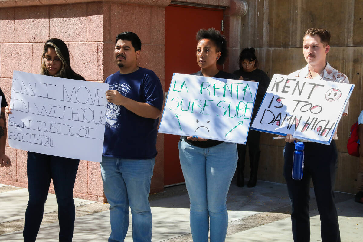 Activists and community members gather together in support of tenant rights during a press conf ...