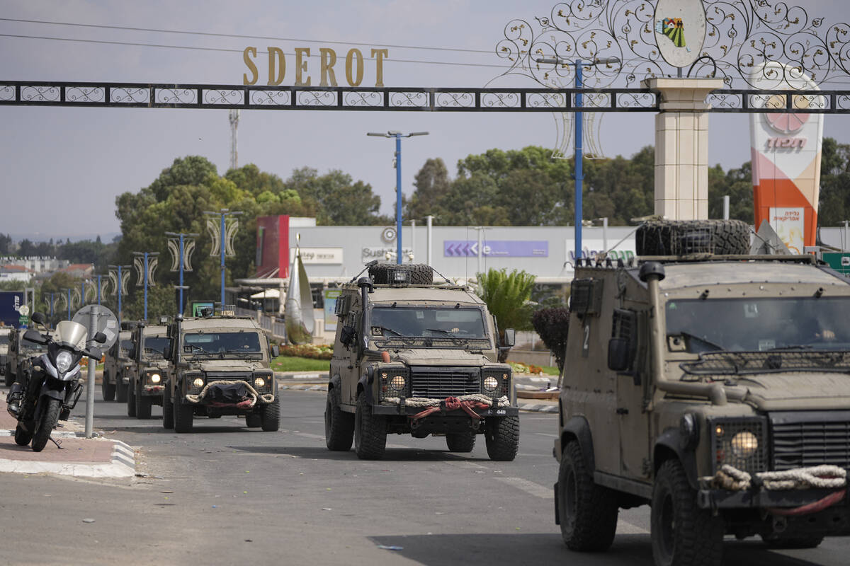 Israeli army column arrives at Sderot, a town close to the Gaza Strip, Wednesday, Oct.11, 2023. ...