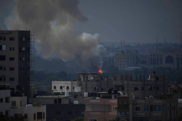 Fire and smoke rise following an Israeli airstrike in Gaza City, Wednesday, Oct. 11, 2023. The ...