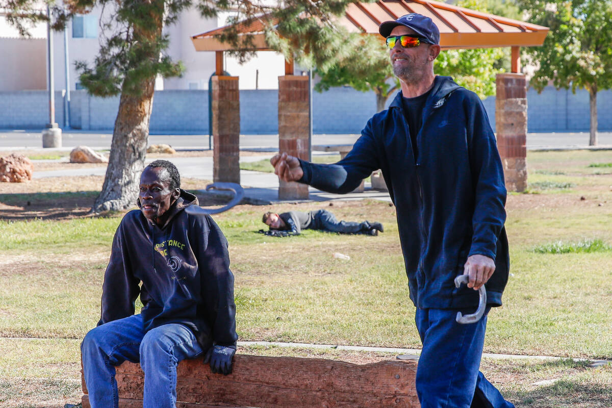 Two friends play horseshoes while someone rests in the grass at the Russell Road Recreation Com ...