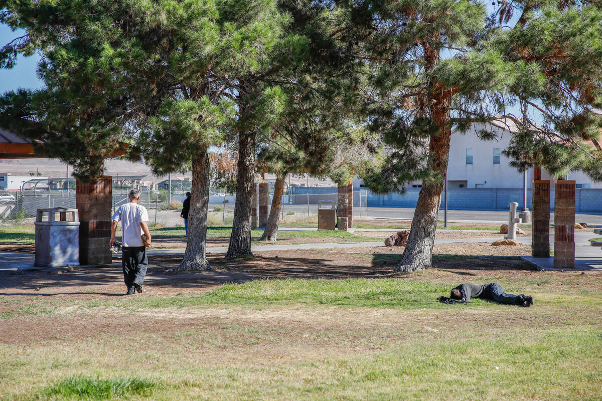 People rest in the lawn at the Russell Road Recreation Complex on Thursday, Oct. 12, 2023 in He ...