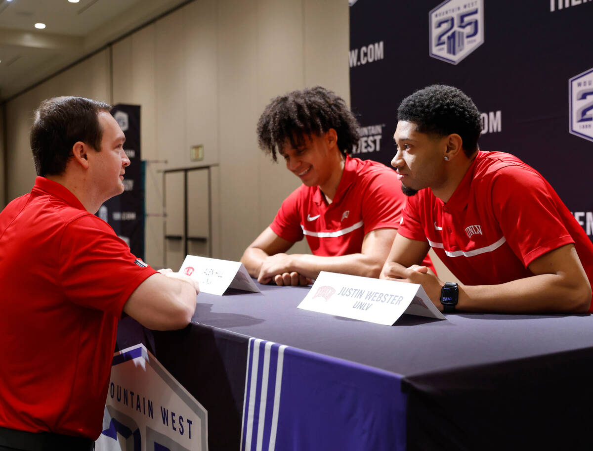UNLV Rebels head coach Kevin Kruger, left chats with forward Jalen Hill, center, and guard Just ...