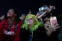 Fans sing and dance to My Chemical Romance while they play their song “I’m Not Ok ...