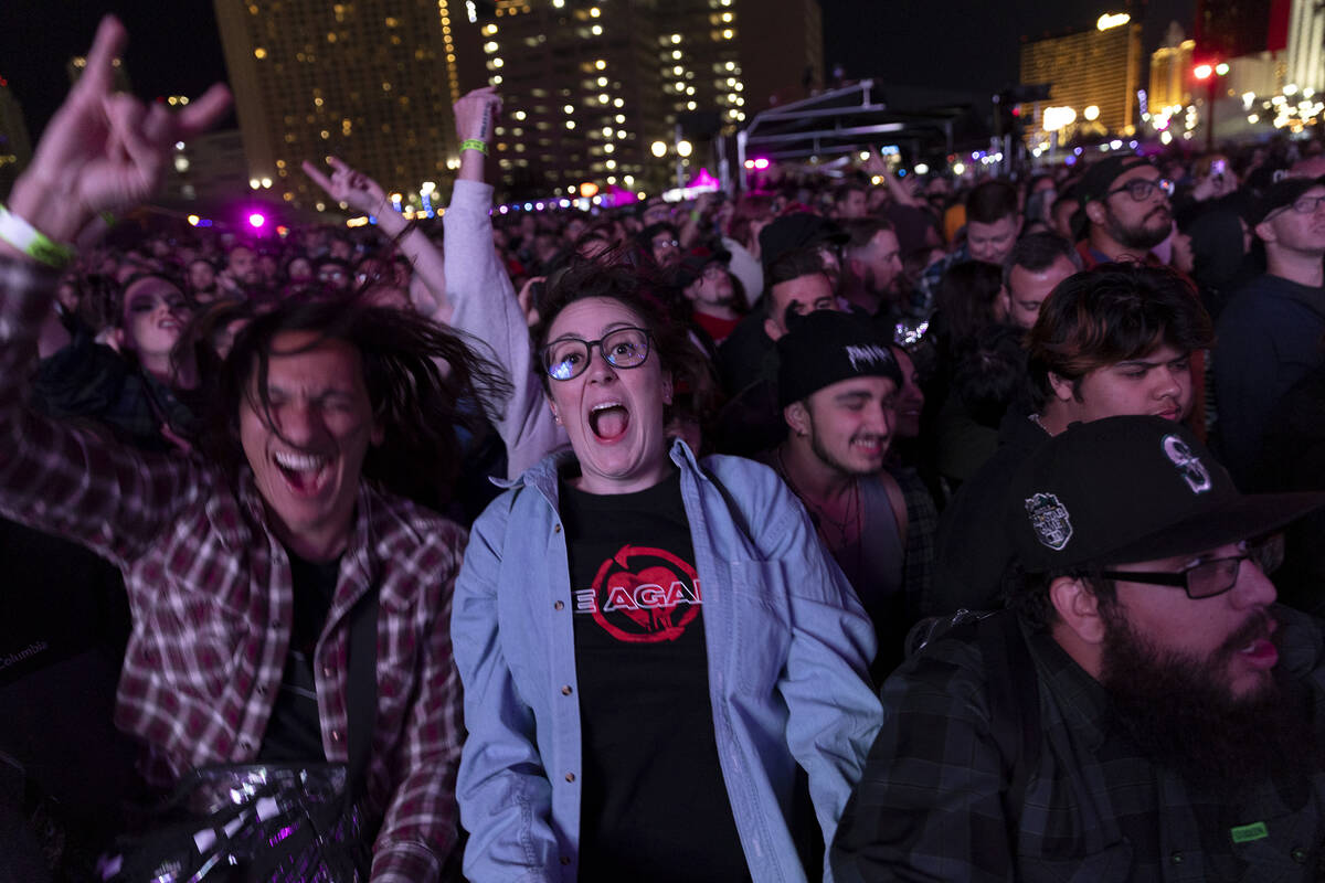 A group of fans dances to Alkaline Trio’s set during When We Were Young music festival a ...