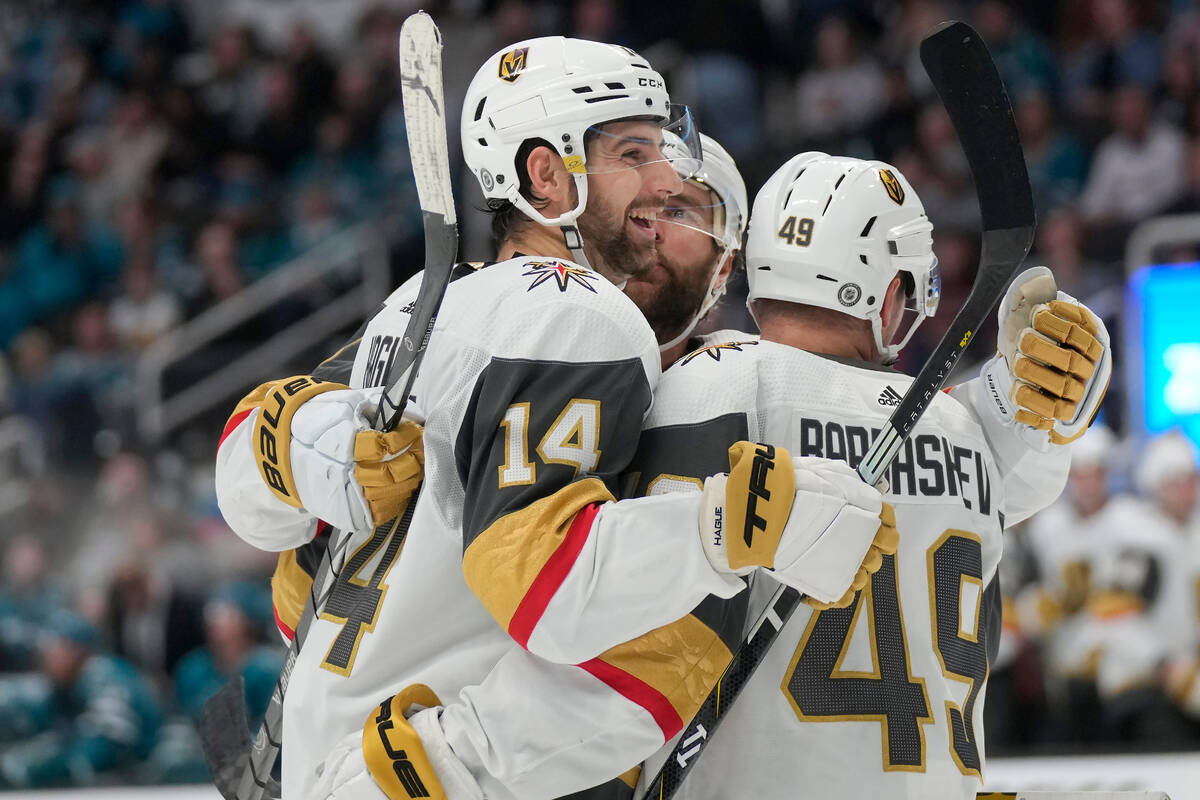 Vegas Golden Knights defenseman Nicolas Hague (14) is congratulated by teammates after his goal ...