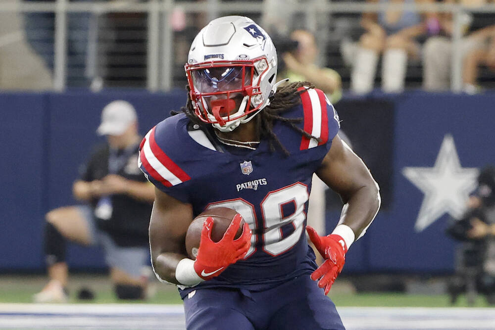 New England Patriots running back Rhamondre Stevenson (38) runs against the Dallas Cowboys duri ...