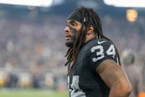 Raiders running back Brandon Bolden (34) looks on from the sideline during the second half an N ...